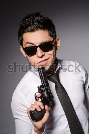 Man wearing sunglasses with gun Stock photo © Elnur