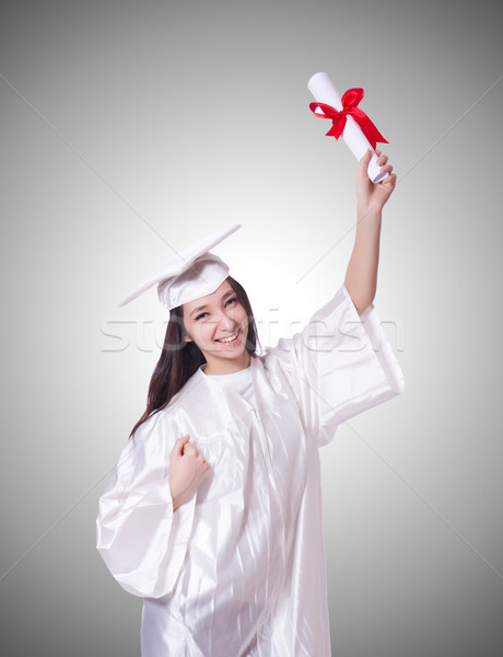 Stock photo: Young female student with diploma on white