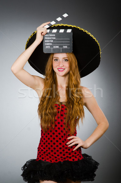 Funny mexican woman with sombrero and movie clapboard Stock photo © Elnur