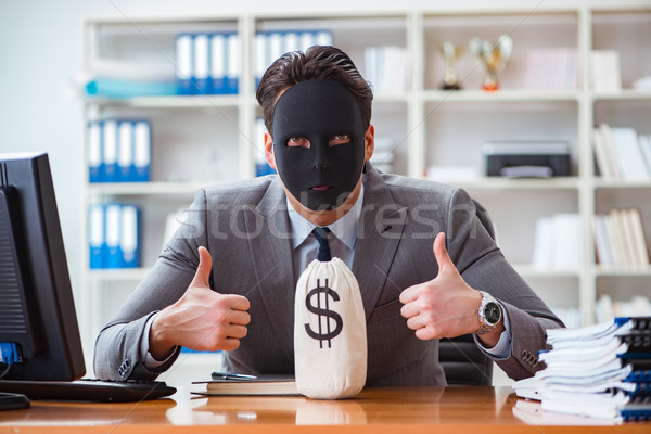 Businessman with mask in office hypocrisy concept Stock photo © Elnur