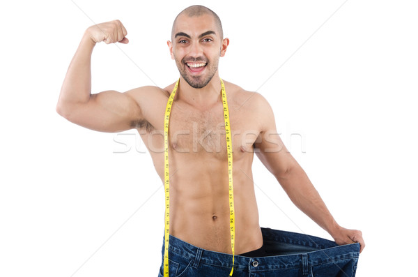 Man in dieting concept with oversized jeans Stock photo © Elnur