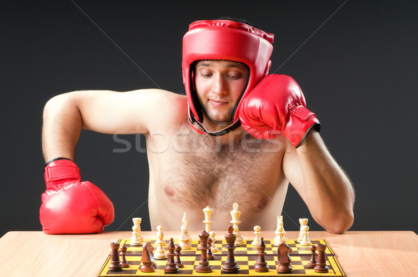 Boxer stuggling with chess game Stock photo © Elnur