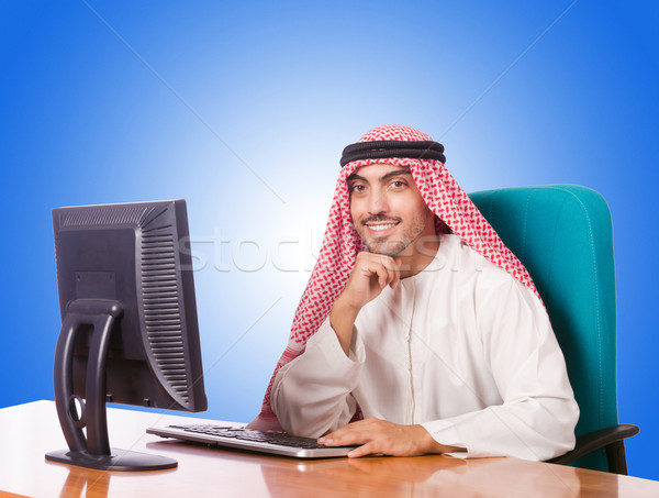 Stock photo: Arab businessman working on computer