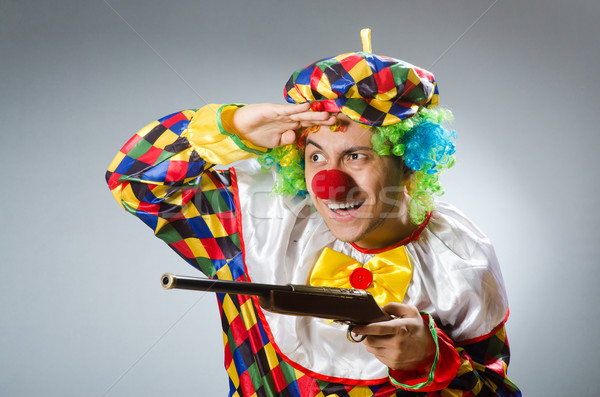 Clown with rifle isolated on white Stock photo © Elnur