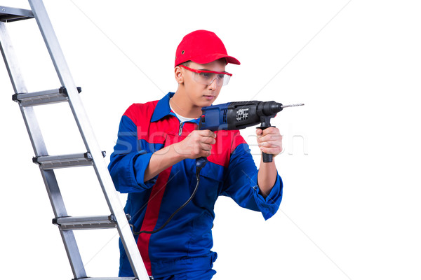 Young repairman with drill perforator isolated on white Stock photo © Elnur