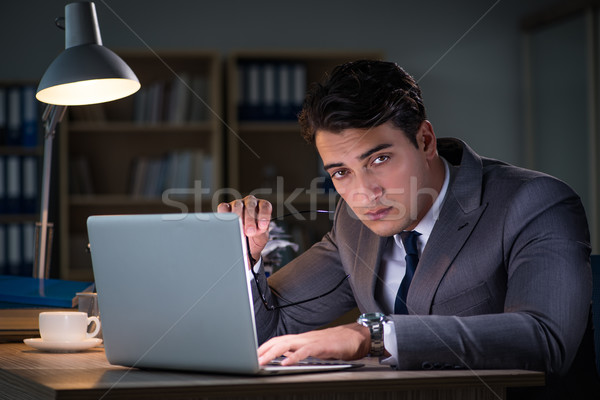 The man staying in the office for long hours Stock photo © Elnur