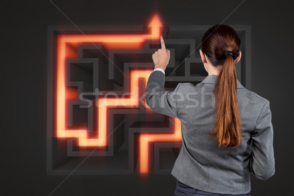 Businesswoman with maze in difficult situations concept Stock photo © Elnur