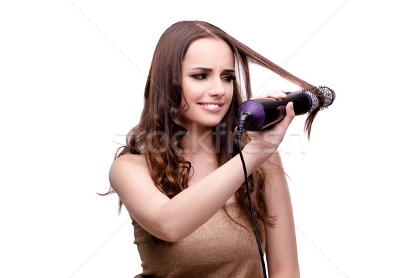 Beautiful woman getting her hair done with hair dryer isolated o Stock photo © Elnur