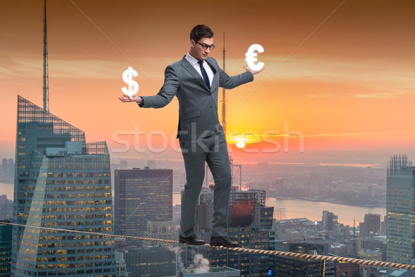 Businessman balancing between choosing dollar and euro Stock photo © Elnur