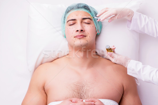 The handsome man in spa massage concept Stock photo © Elnur