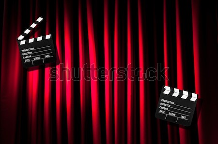 Girl with movie board against curtains Stock photo © Elnur