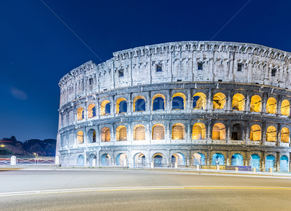 Famous colosseum during evening hours Stock photo © Elnur