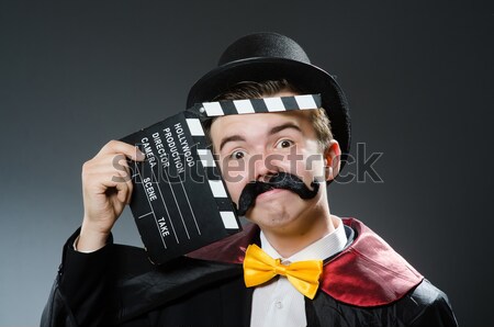 Young prisoner with handgun against gray Stock photo © Elnur