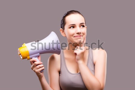 Woman in sports concept with loudspeaker Stock photo © Elnur