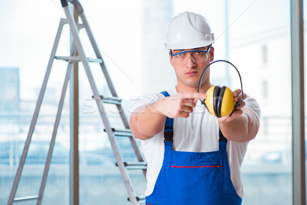 Young worker with noise cancelling headphones Stock photo © Elnur