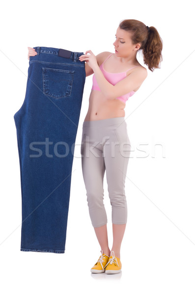 Woman in dieting concept with big jeans Stock photo © Elnur
