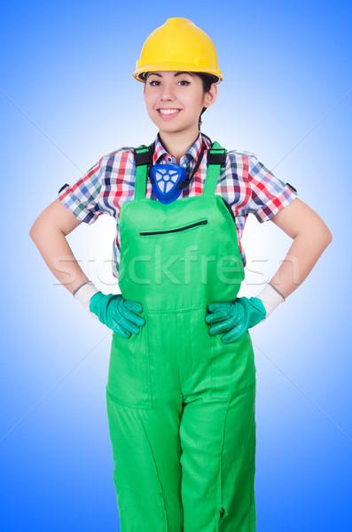 Young woman in green coveralls Stock photo © Elnur