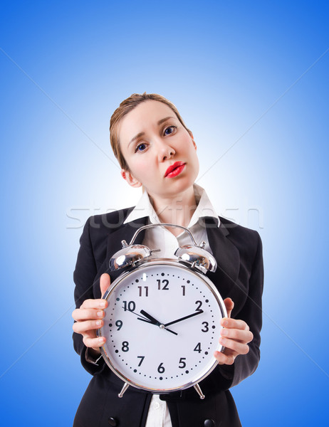 Woman businesswoman with giant clock Stock photo © Elnur