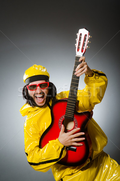 Divertente uomo indossare giallo suit giocare Foto d'archivio © Elnur