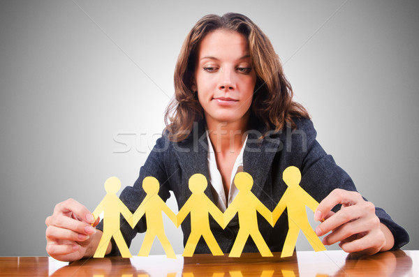 Woman with paper cut people Stock photo © Elnur