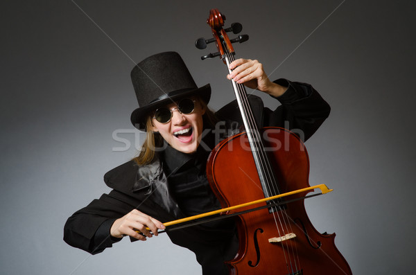 Stock photo: Woman playing classical cello in music concept