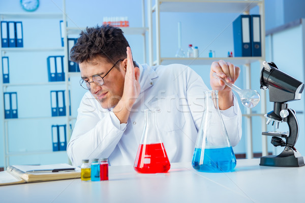 Funny mad chemist working in a laboratory Stock photo © Elnur