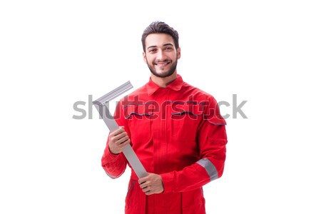 Young repairman with a square ruler isolated on white background Stock photo © Elnur