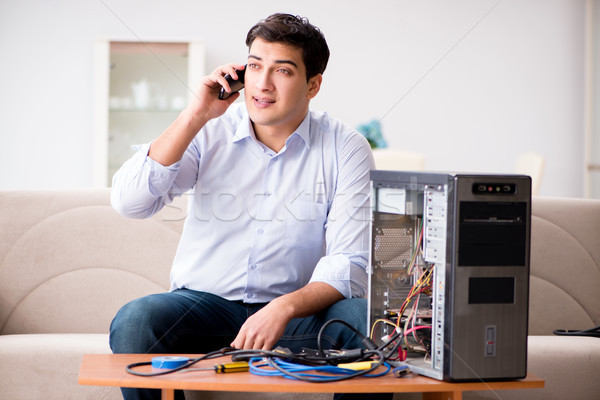 Happy customer resolving his computer problem Stock photo © Elnur