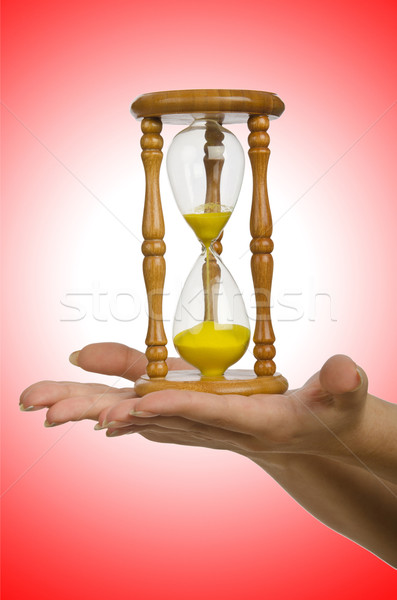Hand holding hourglass on white Stock photo © Elnur