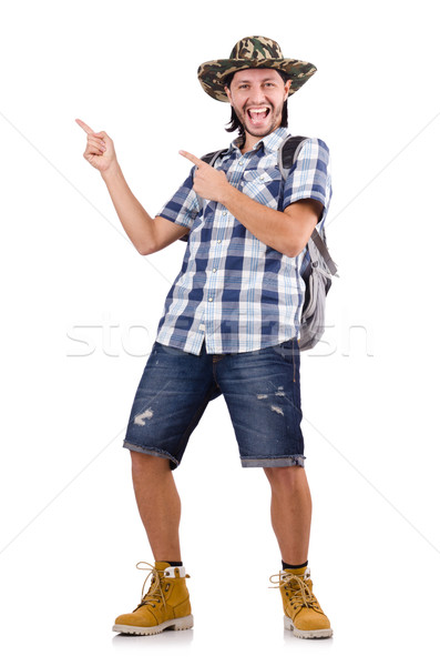 Young traveller with backpack pointing isolated on white Stock photo © Elnur