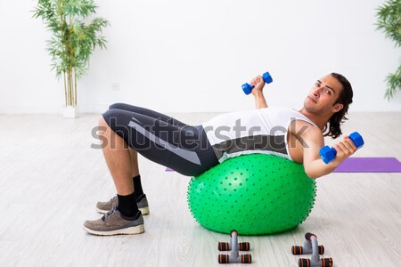 Young woman exercising with swiss ball Stock photo © Elnur