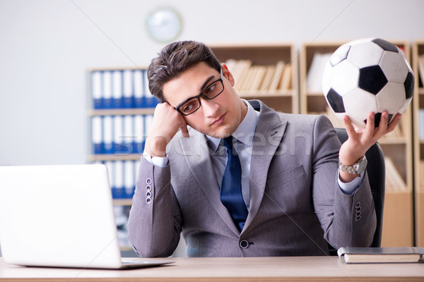 Businessman with football ball in office Stock photo © Elnur