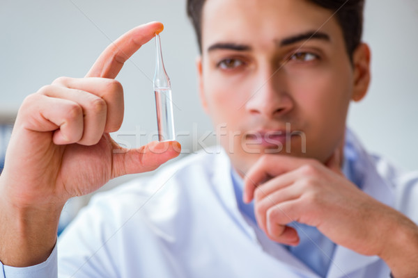 The doctor holding medicines in the lab Stock photo © Elnur