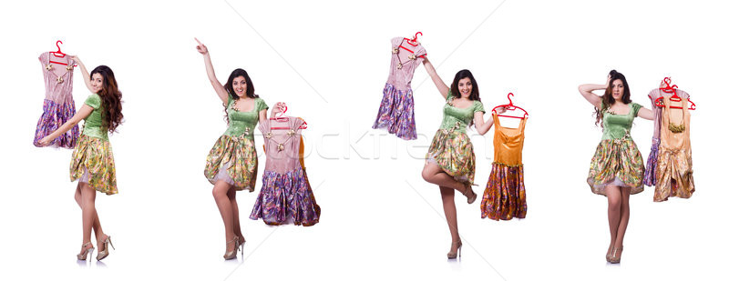 Woman trying to choose dress on white Stock photo © Elnur