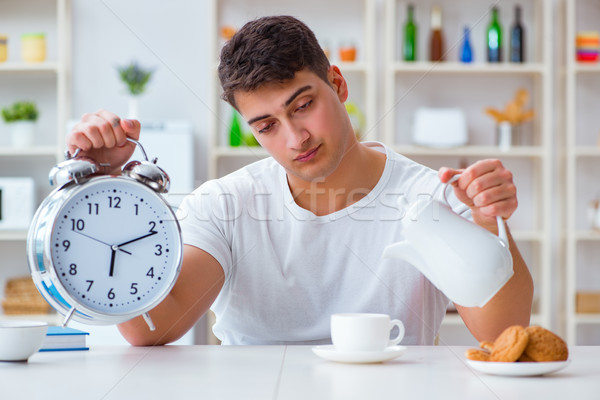 Homem despertador queda café da manhã relógio Foto stock © Elnur