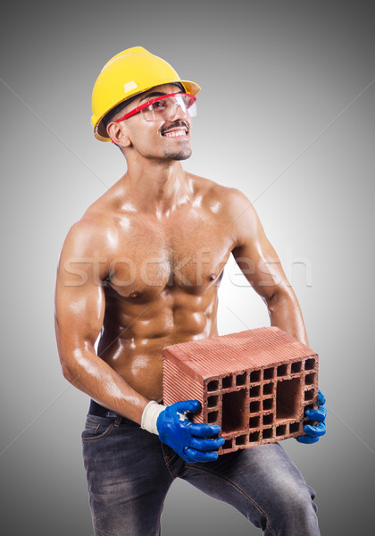 Muscular construtor tijolos branco construção trabalhar Foto stock © Elnur