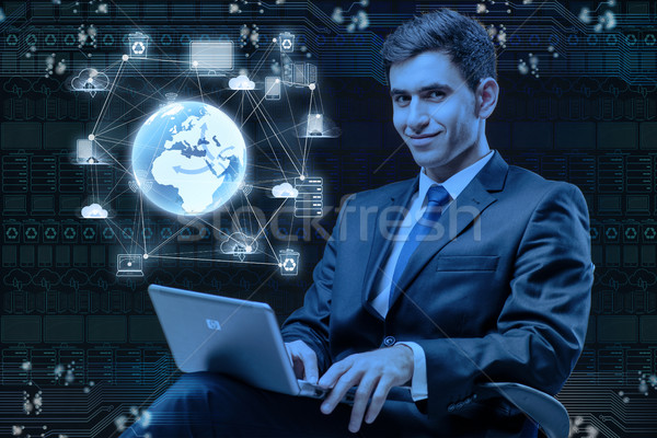 молодые бизнесмен глобальный вычисление компьютер служба Сток-фото © Elnur