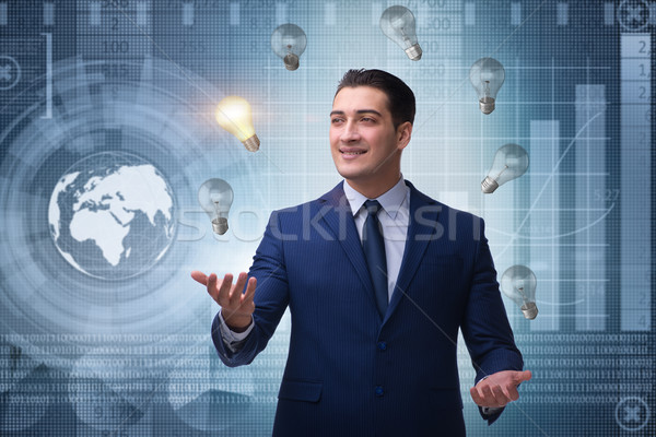 Stock photo: Businessman juggling lightbulbs in new idea concept