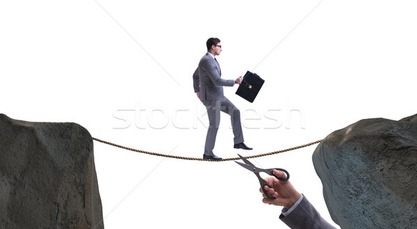 Hand cutting the rope under businessman tightrope walker Stock photo © Elnur