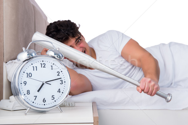 Foto stock: Hombre · cama · sufrimiento · insomnio · reloj · salud