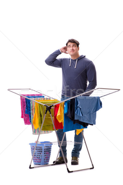 The husband man doing laundry isolated on white Stock photo © Elnur