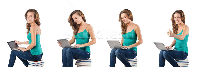 Student with netbook sitting on books Stock photo © Elnur