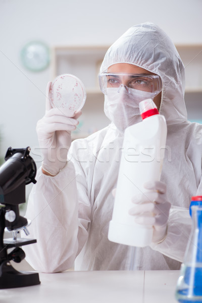 Chemist checking the quality of bathroom supplies Stock photo © Elnur