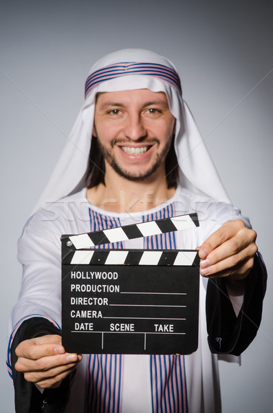 Arab businessman with movie board Stock photo © Elnur