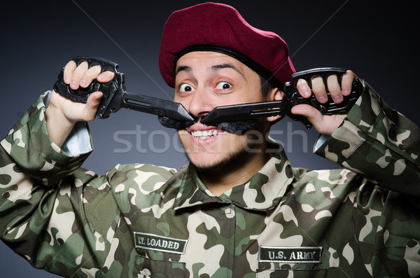 Funny soldier against the dark background Stock photo © Elnur