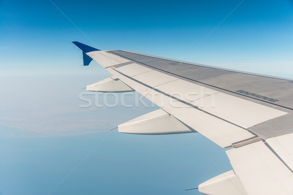 Stock photo: Airplane wing out of window