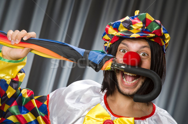 Grappig clown kleurrijk paraplu glimlach man Stockfoto © Elnur