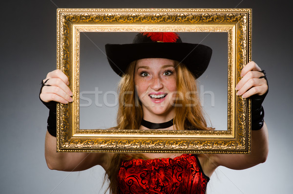 Woman pirate with picture frame Stock photo © Elnur