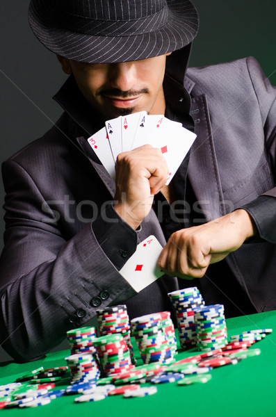 Homme jouer sombre casino vert costume [[stock_photo]] © Elnur