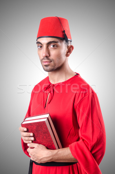 Young turk with book on white Stock photo © Elnur